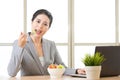 Young asian businesswoman enjoying a healthy salad Royalty Free Stock Photo