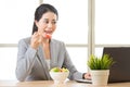 Young asian businesswoman enjoying a healthy salad Royalty Free Stock Photo