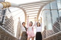 Young asian businesswoman group in formal wear, they raising hands showing success symbol meaning of project successful and