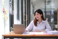 Young Asian businesswoman is happy to work at the modern office using a tablet. Royalty Free Stock Photo