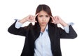 Young Asian businesswoman headache point to her head