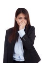 Young Asian businesswoman holding her nose because of a bad smell Royalty Free Stock Photo