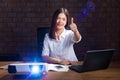 Young asian businesswoman in ligth color shirt working late in h