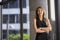 Young Asian businesswoman looking to camera, arms crossed Royalty Free Stock Photo