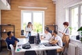 Young asian businesswoman making presentation for multi-ethnic group of listeners