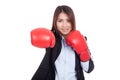 Young Asian businesswoman punch with boxing glove Royalty Free Stock Photo