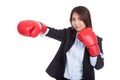 Young Asian businesswoman punch with boxing glove Royalty Free Stock Photo