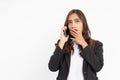 young asian businesswoman shocked and worried while making a phone call Royalty Free Stock Photo