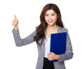 Young Asian businesswoman thumbs up with clipboard
