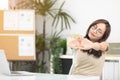 Young asian businesswoman touching massaging stiff neck to relieve pain in muscles Royalty Free Stock Photo