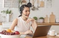 Young Asian businesswoman using computer laptop talking for video call conference meeting. work from home concept Royalty Free Stock Photo