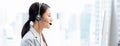 Young Asian businesswoman wearing headsets working as a customer service operator in call center Royalty Free Stock Photo