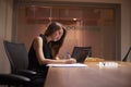 Young Asian businesswoman working alone late in an office