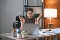 Young Asian businesswoman working on laptop computer, stressed has a headache and thinks hard from work at the office. Royalty Free Stock Photo