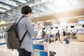 Young asian man waiting for airport check in Royalty Free Stock Photo