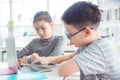 Children using notebook computer at school library,education concept Royalty Free Stock Photo