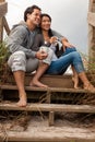 Asian Man Woman Romantic Couple Drinking Coffee on Beach Steps Royalty Free Stock Photo