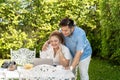 Young Asian chubby couple using a laptop in the outdoors green park together. Happy smiling man and woman working Royalty Free Stock Photo