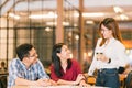 Young Asian college students or coworkers social meeting at coffee shop