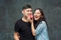 Young asian couple enjoy eating of sweet colorful donut Royalty Free Stock Photo