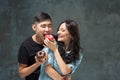 Young asian couple enjoy eating of sweet colorful donut Royalty Free Stock Photo