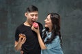 Young asian couple enjoy eating of sweet colorful donut Royalty Free Stock Photo