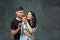 Young asian couple enjoy eating of sweet colorful donut Royalty Free Stock Photo