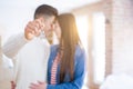 Young asian couple holding keys of new house, smiling happy and excited moving to a new apartment Royalty Free Stock Photo