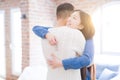 Young asian couple holding keys of new house, smiling happy and excited moving to a new apartment Royalty Free Stock Photo