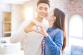 Young asian couple holding keys of new house, smiling happy and excited moving to a new apartment Royalty Free Stock Photo