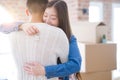 Young asian couple holding keys of new house, smiling happy and excited moving to a new apartment Royalty Free Stock Photo