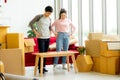 Young Asian couple loers move the cardboard boxes to new family house Royalty Free Stock Photo