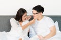 Young asian couple love man and woman woke up in morning on the bed and happy moment Royalty Free Stock Photo