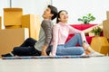 Young Asian couple lovers move the cardboard boxes to new family house Royalty Free Stock Photo
