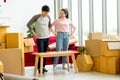 Young Asian couple lovers move the cardboard boxes to new location Royalty Free Stock Photo