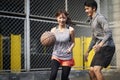 Young asian couple playing basketball together Royalty Free Stock Photo