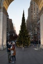 Young Asian Couple taking a Selfie Photo in front of the Washington Square Park Christmas Tree in New York City Royalty Free Stock Photo