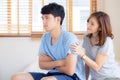 Young asian couple a problem and woman ask forgive and sorry with man feeling angry at bedroom Royalty Free Stock Photo