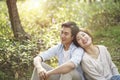 Young asian couple relaxing in park Royalty Free Stock Photo