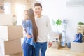 Young asian couple smiling taking a selfie photo with smartphone, moving to a new home together Royalty Free Stock Photo