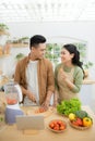 Young Asian couple. Standing cooking in the kitchen Royalty Free Stock Photo