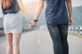 Young asian couple standing and holding hand with pure love