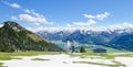 Young couple walks together on Schafberg mountain, Austria