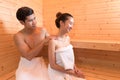 Young Asian couples or lovers have romantic relaxing in sauna room. Skin care heat treatment and body clean up and refreshing in Royalty Free Stock Photo