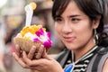 Young Asian cute woman traveler tourist shopping walking on the famous local street market with backpack , food local , vacation, Royalty Free Stock Photo