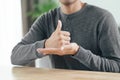 Young Asian deaf disabled man using Sign Language to communicate with other people Royalty Free Stock Photo