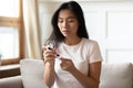 Asian woman measure blood sugar level with glucometer Royalty Free Stock Photo