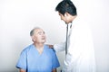 A young Asian Doctor comforting a Senior adult patient Royalty Free Stock Photo