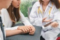 Young Asian doctor consulting patient in hospital office. Health care and medical concept. Encouragement and empathy Royalty Free Stock Photo