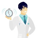 Young asian doctor holding alarm clock. Royalty Free Stock Photo